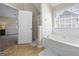 Bathroom featuring a soaking tub, a shower, and natural light filtering through the window at 3842 Monticello St, Douglasville, GA 30135