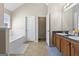 Well-lit bathroom with a soaking tub, double sink vanity, and separate toilet room at 3842 Monticello St, Douglasville, GA 30135