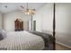 Bedroom with a four-poster bed, dresser, and ceiling fan at 3842 Monticello St, Douglasville, GA 30135