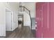Open foyer with hardwood flooring, staircase, and view into the dining room at 3842 Monticello St, Douglasville, GA 30135