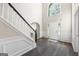 Bright foyer featuring hardwood floors, an arched window, and a white front door at 3842 Monticello St, Douglasville, GA 30135