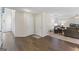Hallway features dark hardwood floors, white doors, and living room access at 3842 Monticello St, Douglasville, GA 30135