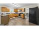Spacious kitchen showcases wood cabinets, stainless steel appliances, and access to dining area at 3842 Monticello St, Douglasville, GA 30135