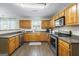 Traditional kitchen features wood cabinets, modern appliances, and neutral countertops at 3842 Monticello St, Douglasville, GA 30135