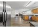 Spacious open-concept kitchen with stainless steel appliances and hardwood flooring at 3842 Monticello St, Douglasville, GA 30135