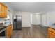Kitchen features a stainless steel refrigerator and hardwood floors at 3842 Monticello St, Douglasville, GA 30135