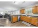 Bright kitchen boasts wood cabinets, stainless steel appliances and an open concept design at 3842 Monticello St, Douglasville, GA 30135