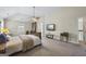 An inviting main bedroom featuring a ceiling fan, natural light, and a calming color palette at 3842 Monticello St, Douglasville, GA 30135