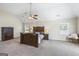 A primary bedroom suite offers a tranquil retreat with soft lighting and a ceiling fan for comfort at 3842 Monticello St, Douglasville, GA 30135