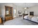 Primary bedroom featuring tray ceilings, a ceiling fan, natural light, and plenty of room for relaxation at 3842 Monticello St, Douglasville, GA 30135