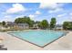 Community swimming pool surrounded by lounge chairs and picnic tables, perfect for summer fun at 3842 Monticello St, Douglasville, GA 30135