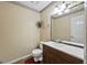 Neutral toned bathroom featuring a toilet and vanity with a large mirror at 244 Timber Creek Ln, Marietta, GA 30060