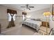 Comfortable bedroom with a ceiling fan and large window featuring a unique curtain rod at 244 Timber Creek Ln, Marietta, GA 30060