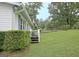 View of home's side yard and front yard at 270 E James Cir, Hampton, GA 30228
