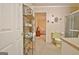 Bathroom provides shelving and leads to the bedroom with a unique yellow toilet at 270 E James Cir, Hampton, GA 30228
