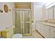 Bathroom showcasing a shower stall, yellow toilet, vanity, and matching countertop at 270 E James Cir, Hampton, GA 30228