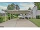 Spacious carport area providing covered parking and convenient access to the home and the lake at 270 E James Cir, Hampton, GA 30228