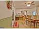 Bright dining area with wood floors and view into the kitchen and living room at 270 E James Cir, Hampton, GA 30228