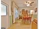 Inviting dining room with wood table, chairs, and decorative shelving unit at 270 E James Cir, Hampton, GA 30228