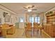 Dining room featuring wood floors, table with chairs, and a ceiling fan at 270 E James Cir, Hampton, GA 30228