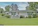Charming single-story home with a well-manicured lawn and welcoming front porch with flower planters at 270 E James Cir, Hampton, GA 30228