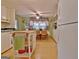 Functional kitchen area with white appliances, island, and a cozy dining nook at 270 E James Cir, Hampton, GA 30228