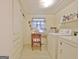 Laundry room with window, washer, dryer and storage cabinets at 270 E James Cir, Hampton, GA 30228