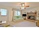 Comfortable living room featuring neutral carpet and a brick fireplace at 270 E James Cir, Hampton, GA 30228