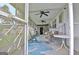 Inviting screened-in porch with rocking chairs offering a comfortable outdoor living space and backyard views at 270 E James Cir, Hampton, GA 30228
