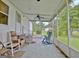 Comfortable screened-in porch with various seating options and outdoor living space at 270 E James Cir, Hampton, GA 30228
