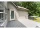 A gray painted wooden deck provides a great space for outdoor enjoyment at 40 Wenham Ln, Sharpsburg, GA 30277