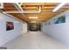Unfinished basement with exposed ceiling, painted walls, and potential recreation space at 40 Wenham Ln, Sharpsburg, GA 30277