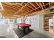 Basement featuring a pool table, exposed wood ceiling, and walk out to backyard at 40 Wenham Ln, Sharpsburg, GA 30277