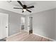 Bright bedroom offering wood floors, a ceiling fan, and convenient access to the en-suite bathroom at 40 Wenham Ln, Sharpsburg, GA 30277