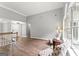 Cozy living room featuring a view into the backyard, staircase, and natural light at 40 Wenham Ln, Sharpsburg, GA 30277