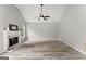 Bright living room features a fireplace, hardwood floors, vaulted ceilings and neutral paint at 40 Wenham Ln, Sharpsburg, GA 30277