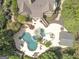Expansive backyard view featuring a large pool, spa, outdoor seating areas, and beautiful landscaping at 113 Regents Sq, Peachtree City, GA 30269
