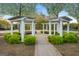 Charming community arbor with benches, set amidst a lush green landscape with brick-paved walkways at 113 Regents Sq, Peachtree City, GA 30269