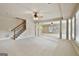 Open basement with stairs, decorative columns, and ample natural light at 113 Regents Sq, Peachtree City, GA 30269