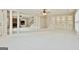 Spacious basement with stone fireplace, built-in shelving, and access to stairs at 113 Regents Sq, Peachtree City, GA 30269