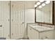 Bathroom featuring a granite countertop, white cabinets, and updated fixtures at 113 Regents Sq, Peachtree City, GA 30269