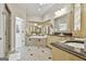 Bright bathroom featuring a soaking tub, double vanity with granite countertops and an open glass shower at 113 Regents Sq, Peachtree City, GA 30269