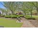 Scenic community park with benches, walking paths, and lush greenery, perfect for relaxation at 113 Regents Sq, Peachtree City, GA 30269