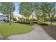 Inviting community park with walking paths, benches, and lush greenery, perfect for leisure activities at 113 Regents Sq, Peachtree City, GA 30269