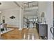 Elegant foyer with hardwood floors, staircase, and views into the living room at 113 Regents Sq, Peachtree City, GA 30269