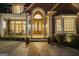 Inviting front entrance with brick walkway, columns, and double doors at 113 Regents Sq, Peachtree City, GA 30269