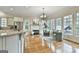 Bright and open living room with a fireplace, hardwood floors, and plenty of natural light at 113 Regents Sq, Peachtree City, GA 30269