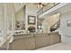 Spacious living room with a stone fireplace, built-in shelving, and a view of the upper-level balcony at 113 Regents Sq, Peachtree City, GA 30269