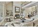 Cozy living room with a stone fireplace, built-in shelving, and comfortable seating at 113 Regents Sq, Peachtree City, GA 30269