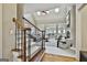 Inviting living room with a staircase, soaring ceilings, and large windows offering plenty of natural light at 113 Regents Sq, Peachtree City, GA 30269